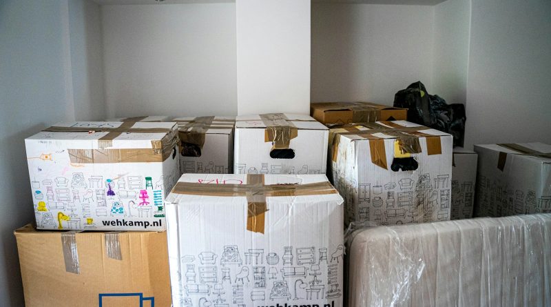 brown cardboard boxes on brown wooden table